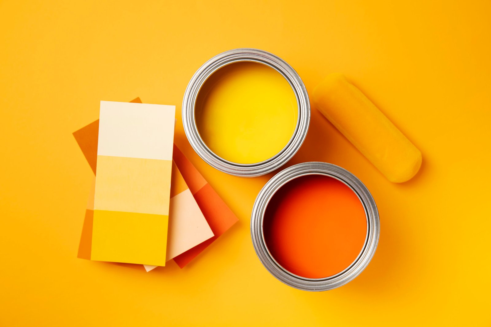 view cans with orange yellow paint